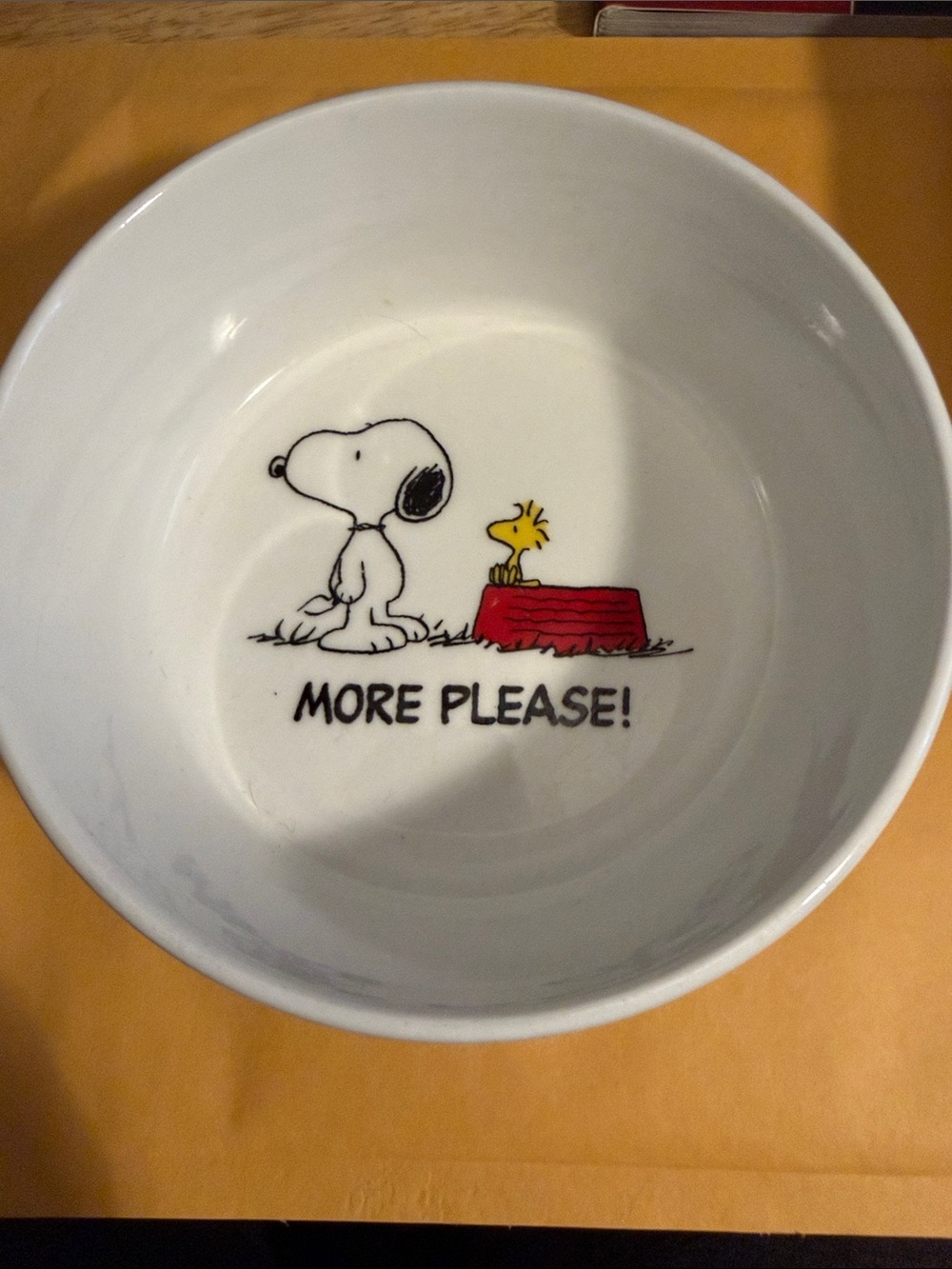 Gibson White Ceramic Peanuts 'MORE PLEASE!' Dog Bowl with Red Bowl Graphic